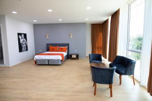 A bed or beds in a room at ZOOM HOTEL
