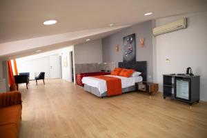 A bed or beds in a room at ZOOM HOTEL