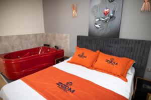 A bed or beds in a room at ZOOM HOTEL
