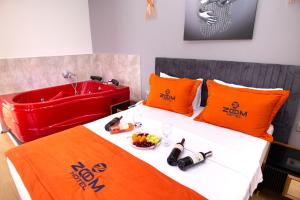A bed or beds in a room at ZOOM HOTEL