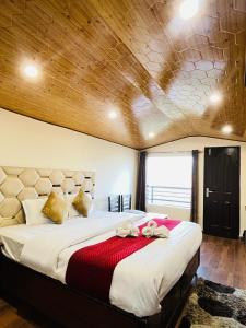 Postel nebo postele na pokoji v ubytování Ambrosia Grand