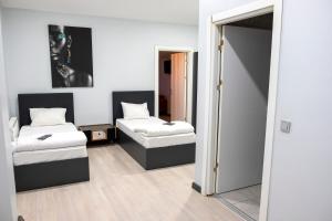 A bed or beds in a room at ZOOM HOTEL