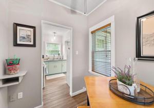 a dining room with a table and a kitchen at Double the Space for Large Groups Entire Duplex in Cleveland +50 photos