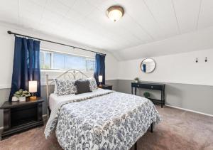 a bedroom with a large bed and a window at Double the Space for Large Groups Entire Duplex in Cleveland