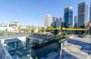 a view of a city from a balcony of a building at Cozy 3BR High Rise with Pool with great views in Los Angeles