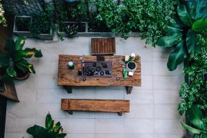 an overhead view of a table and chairs in a garden at GOYA hotel in Chiang Mai