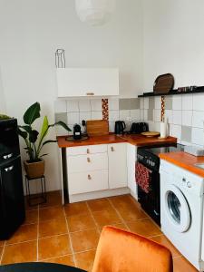 Kuchyňa alebo kuchynka v ubytovaní Charm Boutique Apartment
