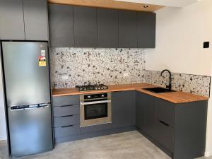 Η κουζίνα ή μικρή κουζίνα στο Modern, warm and comfi - L'Appart in Houghton Bay +12 φωτογραφίες