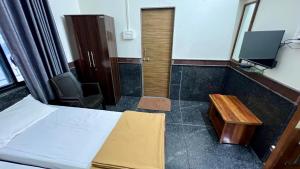 Fotografie z fotogalerie ubytování RajGaurav Lodging v destinaci Kolhápur