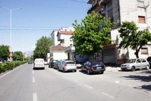 a street with cars parked on the side of the road at Dream House Enia 4 in Shkodër