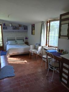 Кровать или кровати в номере Chambres d'hotes du Moulin