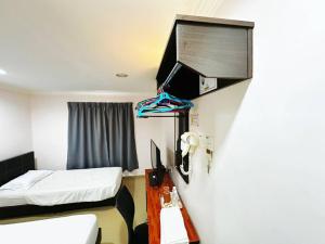 Postel nebo postele na pokoji v ubytování OYO 91150 Hotel Tasik Utama