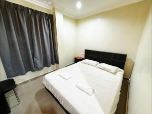 Postel nebo postele na pokoji v ubytování OYO 91150 Hotel Tasik Utama