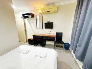 TV a/nebo společenská místnost v ubytování OYO 91150 Hotel Tasik Utama