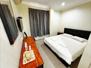Postel nebo postele na pokoji v ubytování OYO 91150 Hotel Tasik Utama + 37 fotografií