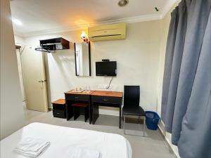 TV a/nebo společenská místnost v ubytování OYO 91150 Hotel Tasik Utama