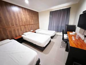 Postel nebo postele na pokoji v ubytování OYO 91150 Hotel Tasik Utama