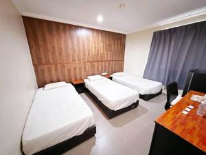 Postel nebo postele na pokoji v ubytování OYO 91150 Hotel Tasik Utama
