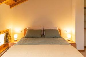 Ένα ή περισσότερα κρεβάτια σε δωμάτιο στο Duplex nelle Dolomiti a 1 ora da Cortina +18 φωτογραφίες