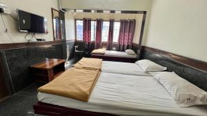 Fotografie z fotogalerie ubytování RajGaurav Lodging v destinaci Kolhápur