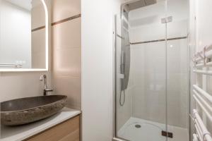 a bathroom with a sink and a shower at Stunning 3Bedroom Apartment with Garden in Prestigious Area I Eiffel Tower Within 15 Minutes' Drive in Issy-les-Moulineaux