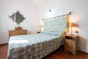 Giường trong phòng chung tại Villino Tavolara a San Teodoro