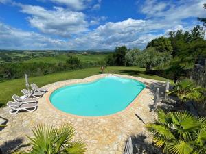 a swimming pool with lounge chairs around it at Dimora Senea - Stunning Panoramic Pool in Rapolano Terme