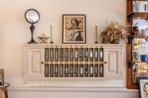 a white mantle with a shelf with a clock on it at Hotel du Palais in Montpellier
