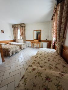 Postel nebo postele na pokoji v ubytování Hotel Pace