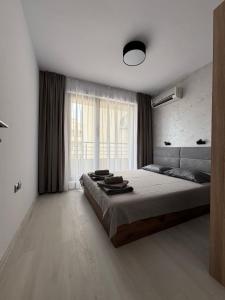 Postel nebo postele na pokoji v ubytování Horizont Apartment Sozopol