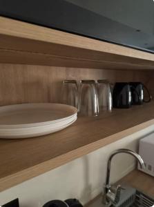a plate on a shelf above a kitchen sink at Mountain view in Al-ʿUla +31 photos