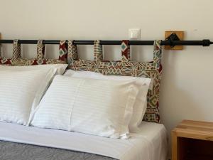 Postel nebo postele na pokoji v ubytování ELÉA Guesthouse himare
