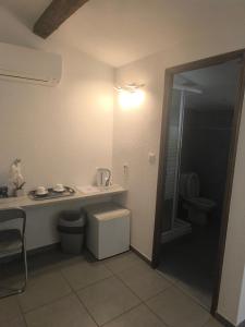 a bathroom with a toilet and a sink and a shower at Casa Stella in Olmeto