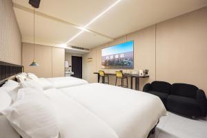 Postel nebo postele na pokoji v ubytování 珠珠酒店 上海浦东国际机场店