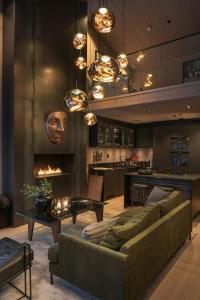 a living room with a couch and a fireplace at Modern Top Floor Apartment By Kvitfjell Ski Resort in Favang