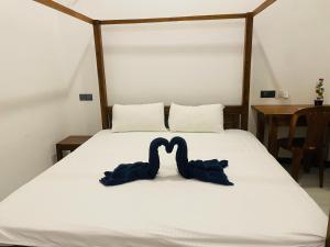Katil atau katil-katil dalam bilik di Alice Rest Arugambay
