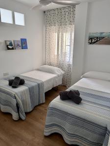 Postel nebo postele na pokoji v ubytování Precioso apartamento frente a la playa