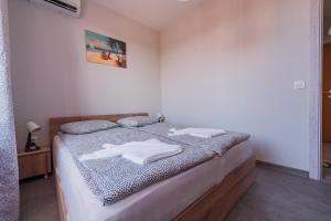 Ένα ή περισσότερα κρεβάτια σε δωμάτιο στο Holiday Apart 1 +8 φωτογραφίες