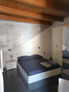 Postel nebo postele na pokoji v ubytování B&B L'Antico Portico