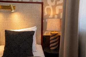 Postel nebo postele na pokoji v ubytování Best Western Plus Grand Hotel