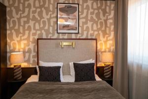 Postel nebo postele na pokoji v ubytování Best Western Plus Grand Hotel