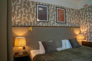 Postel nebo postele na pokoji v ubytování Best Western Plus Grand Hotel