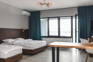 Postel nebo postele na pokoji v ubytování Sofia Hotel