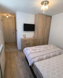 Postel nebo postele na pokoji v ubytování Apartman Vukalović