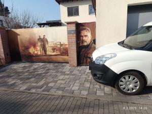 a white car parked in front of a building at Xxx in Golčŭv Jeníkov