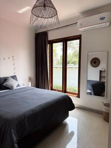 Secret Spot Surf and Stay客房内的一张或多张床位