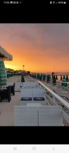 a view of a beach with chairs and umbrellas at Casa Anna in Francavilla al Mare