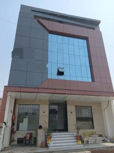 a building with a cat on the side of it at Taj Comfort Inn in Agra