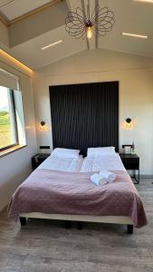 Postel nebo postele na pokoji v ubytování HH Gisting/Guesthouse