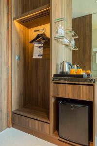 a kitchen with a counter with a sink and a shelf at Ornament Boutique Hotel in Khiva